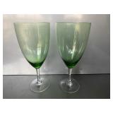 Pair of vintage green glass wine goblets featurin.