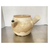 Vintage unglazed earthenware kyusu teapot with a .