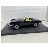 Die-cast scale model of a black Triumph Spitfire .