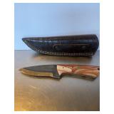 Custom fixed-blade knife crafted from a steel fil.