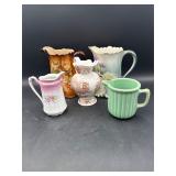5 decorative pitchers
