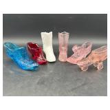 6 miniature glass shoes.