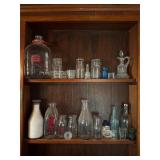Vintage glass bottles and votives