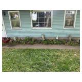 Yard figures in front of house
