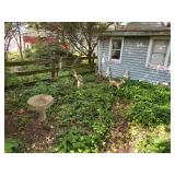 Yard figurines by garage