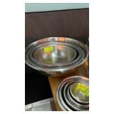 Seven large assorted stainless steel bowls