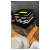 Lot of assorted black-and-white square plates 12