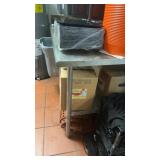 Stainless steel work table with rolled edges and