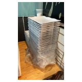 Lot of rectangular plastic plates with scallop