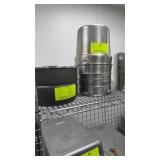 11 assorted pots on top shelf