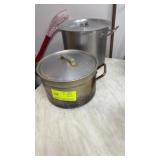 Two pots with two lids one is induction pot