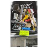Basket of assorted kitchen utensils