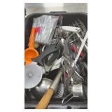 Basket of assorted kitchen utensils