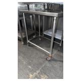 Stainless steel table on casters 25 x 36