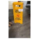 Two wet floor signs