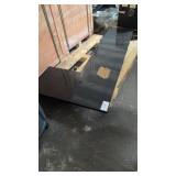 L shaped black granite countertop has two holes
