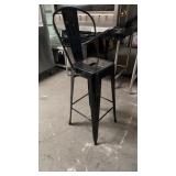 4 black metal outdoor bar stools one has bent leg