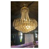 2 chandeliers approximately 24 inches wide by 30