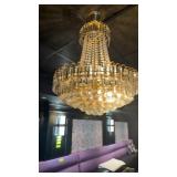 1 chandelier approximately 24 inches wide by 30