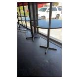 Two high top tables 48 inches round