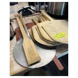 Lot of assorted pizza peels and paddle