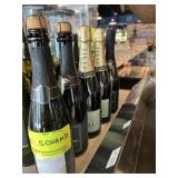 Five assorted bottles of champagne