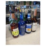 11 open bottles assorted