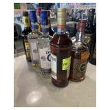 Eight bottles assorted rums