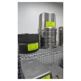 11 assorted pots on top shelf