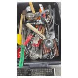 Basket of assorted kitchen utensil