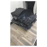 Lot of black plastic shelf liners