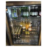 87 assorted bottles of beer in cooler