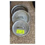 Three small assorted pot lids
