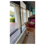 Lot of curtains hanging with tension rods 52