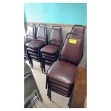 26 maroon colored stack chairs