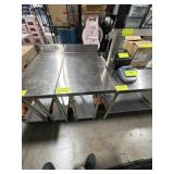 Stainless steel work table with 4 inch backsplash