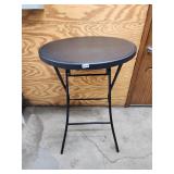 Black plastic round table