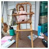 Porcelain Doll and Highchair