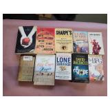 Assorted paperback books.