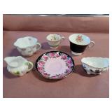 Mismatched teacups, saucer and creamers
