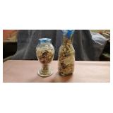 Sea shells on two jars.