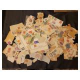 Postage stamps torn from envelopes