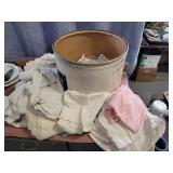 Cardboard barrel of linens and towels.  Good for