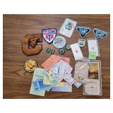 Assorted achievement patches, girl scout pins and