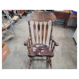 Large wood rocking chair.