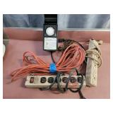 Extension cords, power strips and timer. All