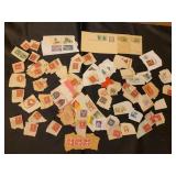 Postage stamps torn from envelopes.