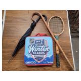 Tennis racket, cane, umbrella and seat cushion