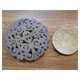 Brass trivets.  One is missing a foot
