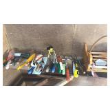 Shelf of mixed garden tools